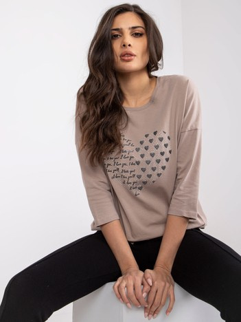 Dunkelbeige Baumwollbluse mit Bindy-Applikation.