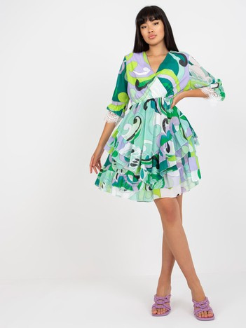 Hurt grün-lila Wickelkleid mit Rüschen und Drucken.