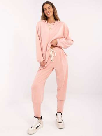 Peach hurt sweatpants with a tie.