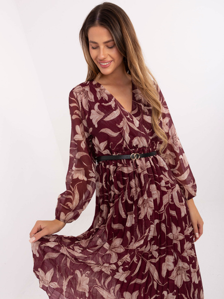 Burgundy pleated dress with a belt.