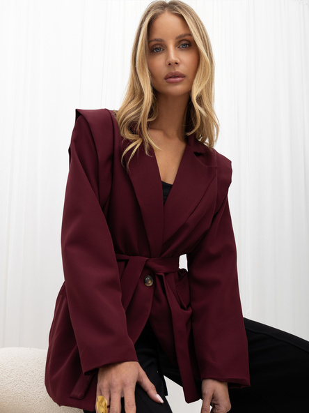 Burgundy women's blazer with geometric shoulders.