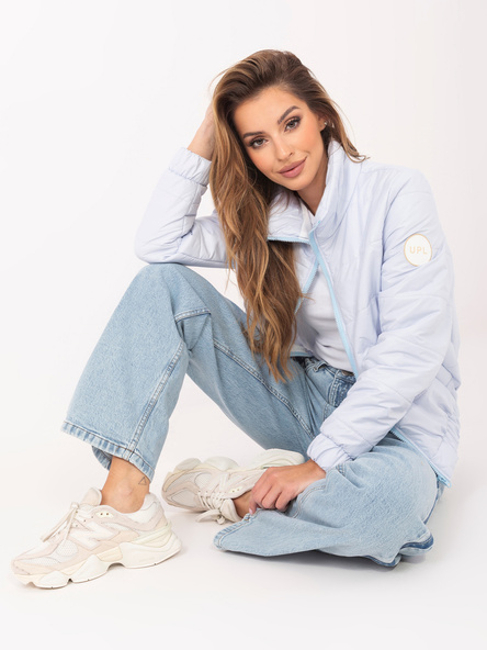 Light blue quilted jacket with a collar.
