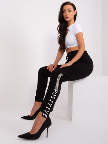 Hurt Black women's sweatpants with an application.