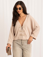 Beige women's cardigan in Asian style.