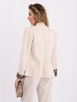 Light beige Napoleon jacket with shoulder pads.