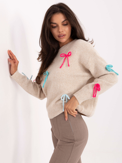 Jasnobeżowy sweter z kolorowymi kokardkami