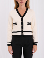 Light beige short cardigan with decorative buttons.
