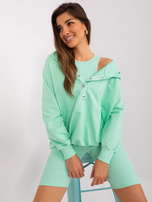 Mintgrünes dreiteiliges Casual-Set aus Baumwolle.