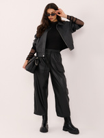 Black women's faux leather pants with a tie.