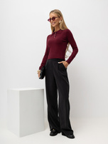 Burgundy women's polo sweater with ribbed cuffs.