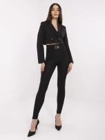 Black women's leggings with a decorative patch.