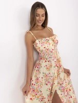 Light yellow summer dress with elastic gathering.