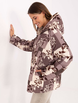 Beżowa przejściowa kurtka oversize z nadrukiem