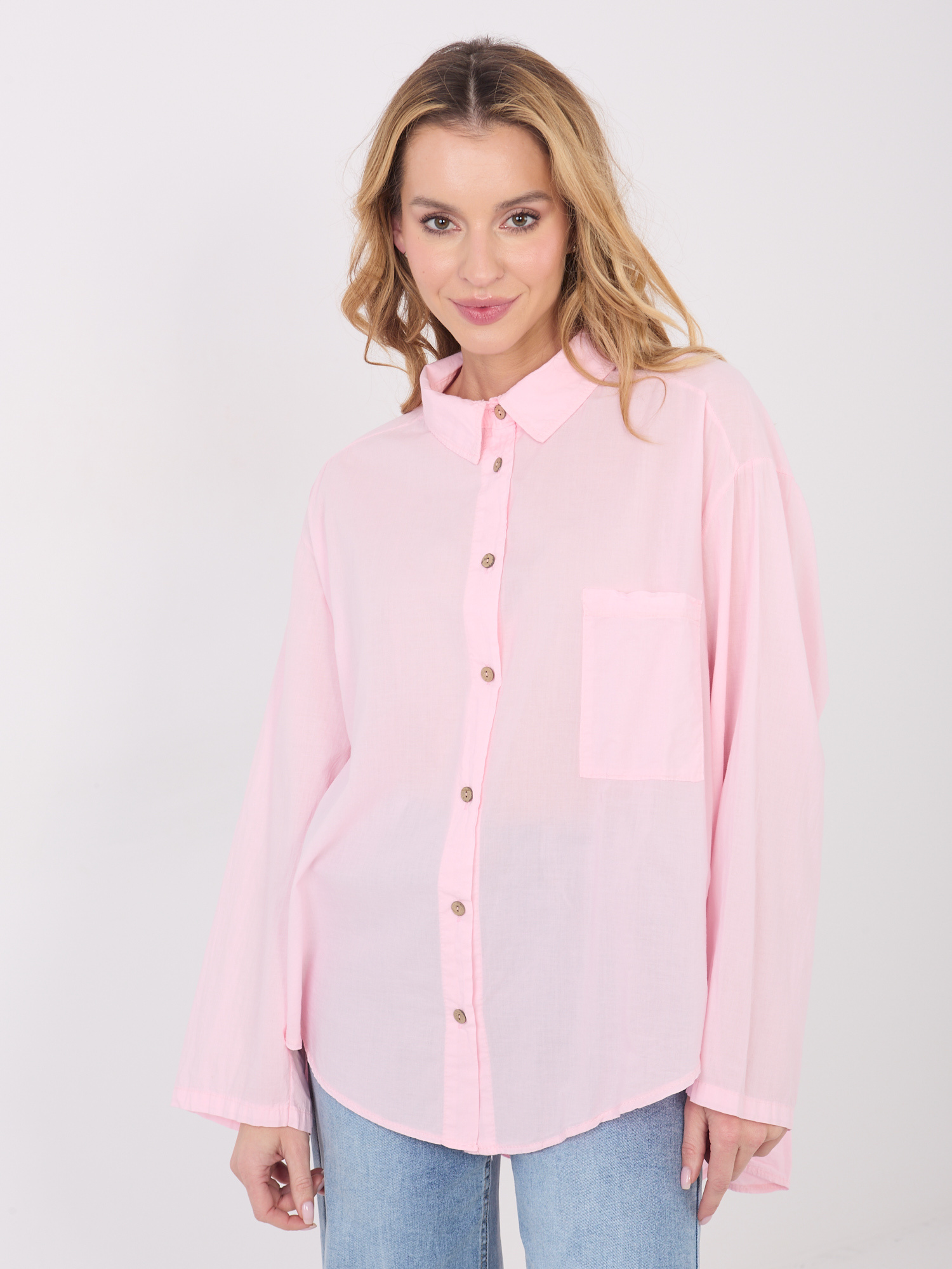 Light pink button-up cotton shirt.