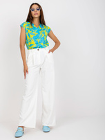 Białe szerokie spodnie garniturowe z kieszeniami