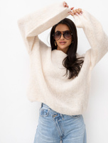 Helle beige Oversize-Pullover mit Puffärmeln.