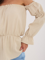 Beige muslin off-shoulder blouse made of cotton.