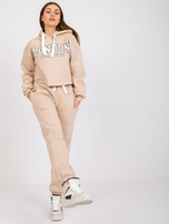 Beżowy komplet dresowy z napisem Laraina