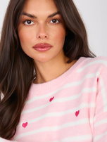 Jasnoróżowy damski sweter oversize w serca 