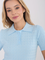 Light blue sweater with buttons at the neckline.