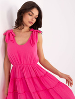 Dark pink dress with ties on the shoulders.