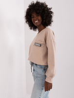 Hurt Beżowa krótka bluzka na co dzień ze ścigaczem