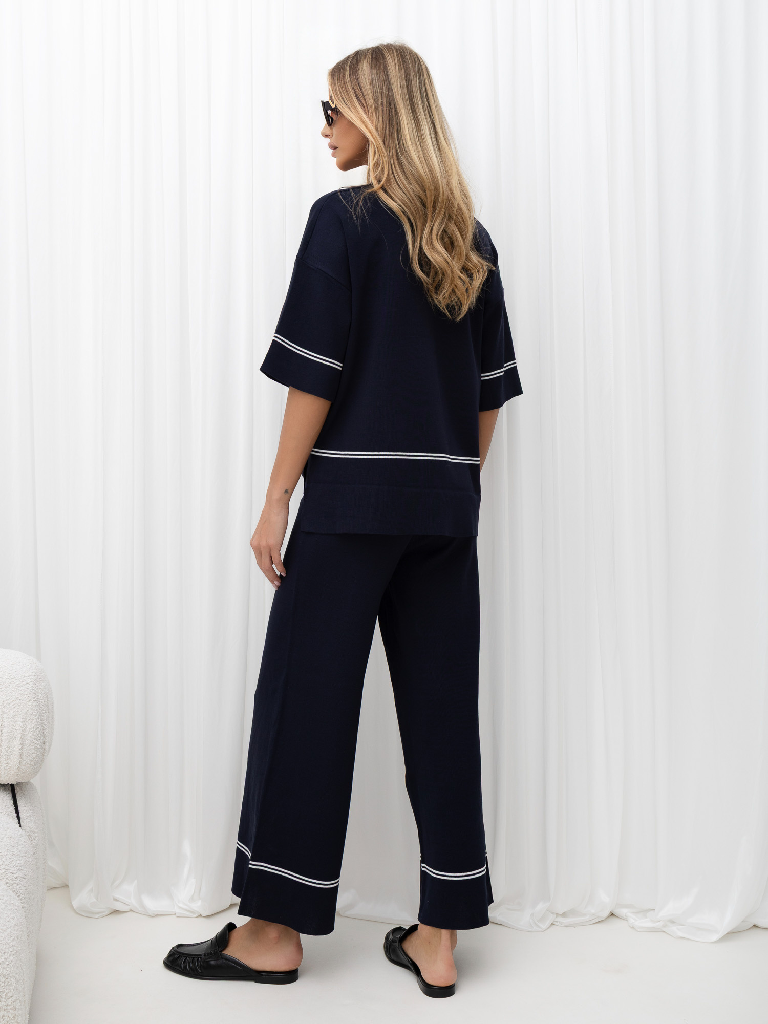 Navy knitted set with minimalist stripes.