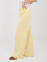 Pastelowe żółte dresowe spodnie z kieszeniami RUE PARIS 