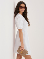 White flared dress with a collar.