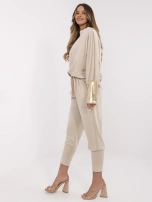 Beżowy damski komplet z błyszczącymi wstawkami 