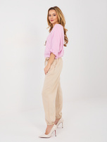 Beżowe dresowe spodnie z miękkiego materiału 