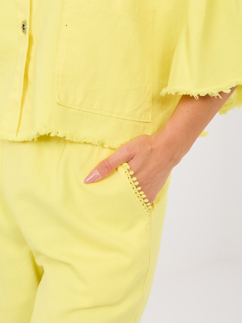 Jasnożółte damskie jeansy z ozdobnymi pomponami