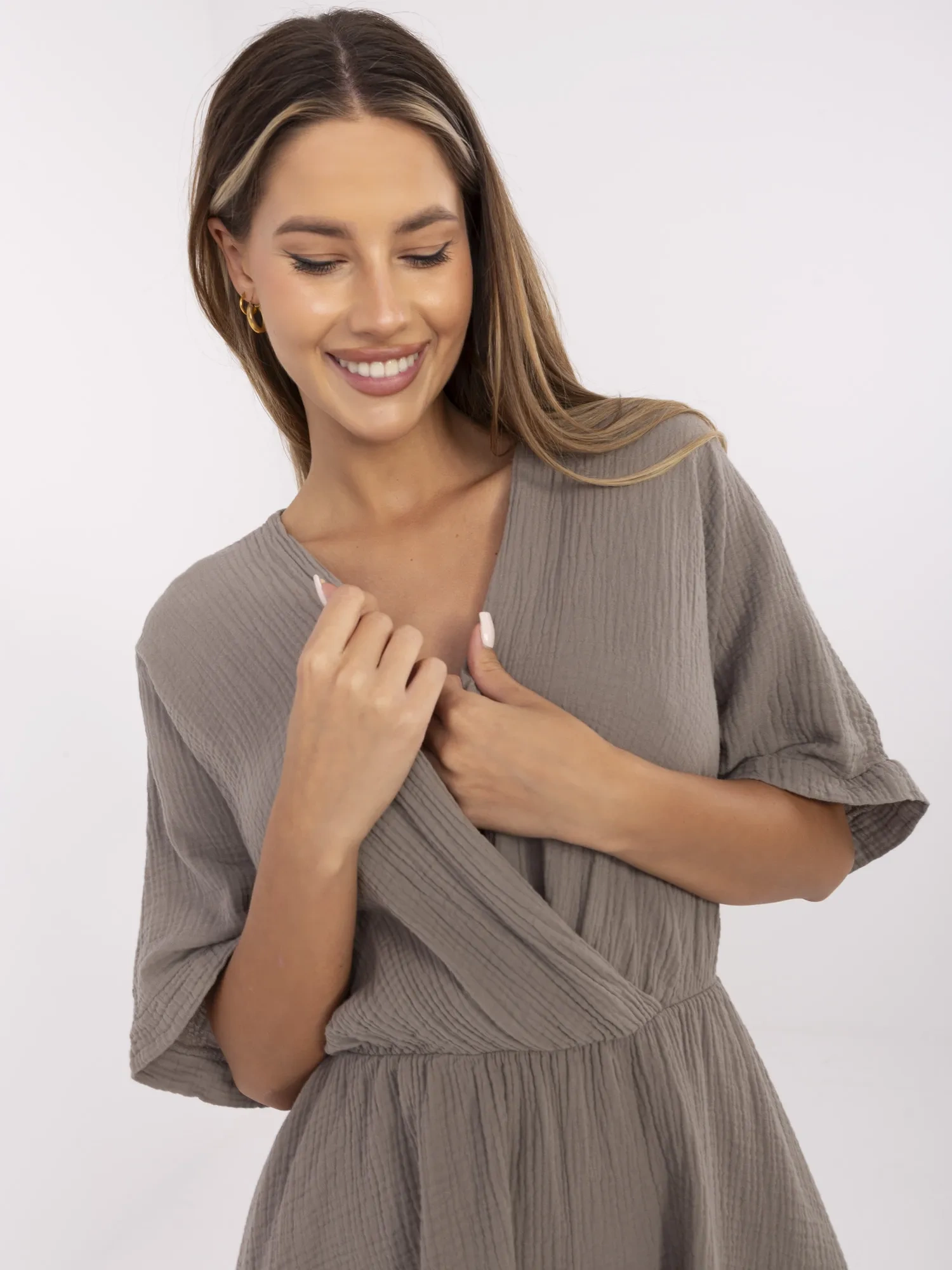 Dark beige muslin jumpsuit with a wrap neckline.