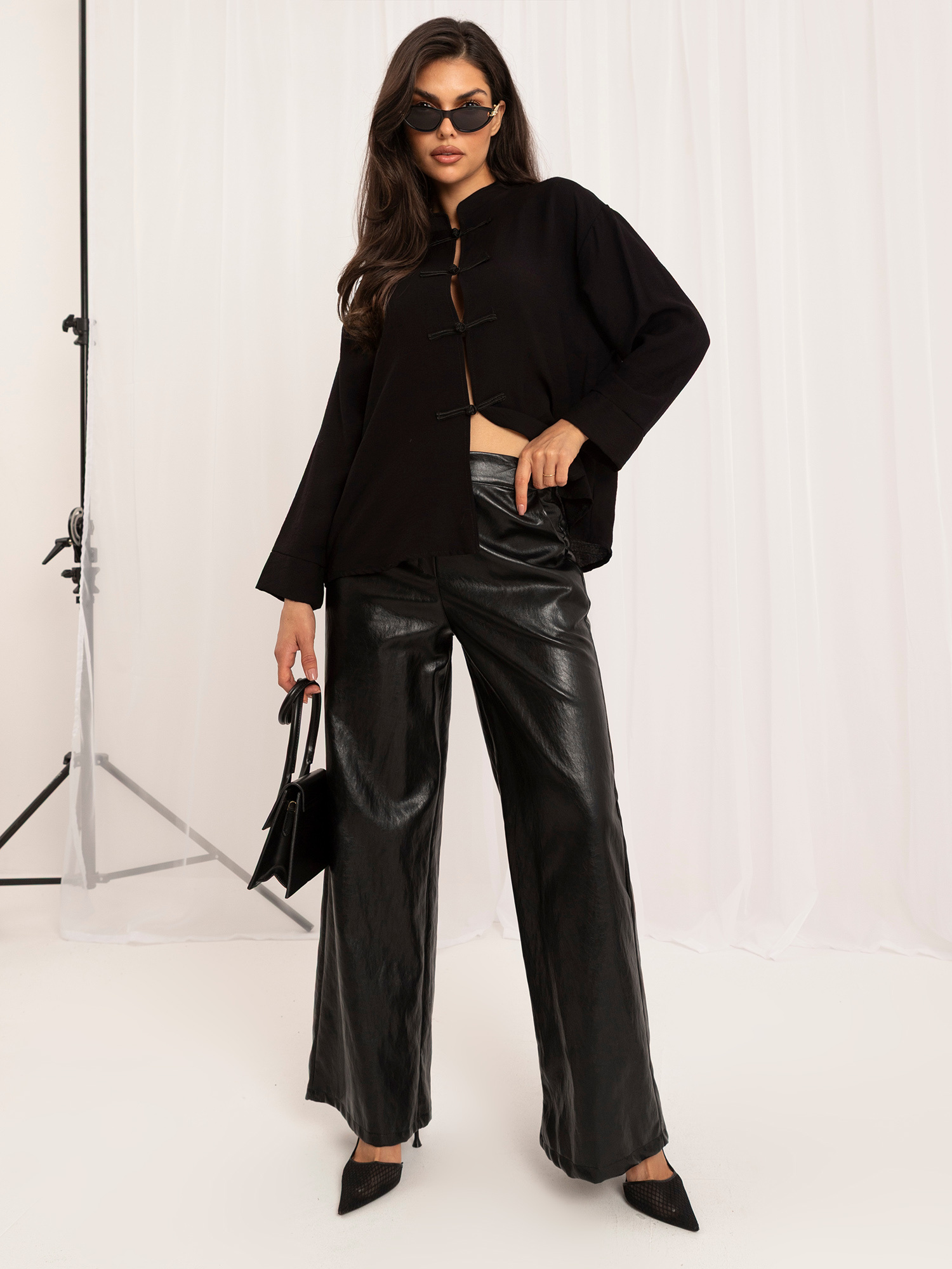 Black shirt blouse with Chinese fastening.