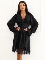 Black flared dress with a waist cut.