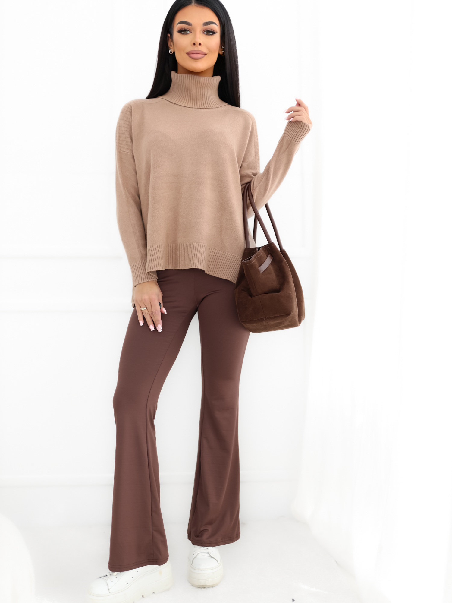 Dark beige oversized sweater with a longer back.
