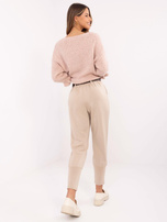 Hurt Beżowe dresowe spodnie z brązowym paskiem