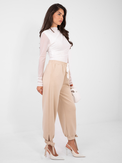 Beżowe dresowe spodnie ze ściągaczami