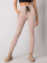 Jasnobeżowe spodnie dresowe z kieszeniami Shadia