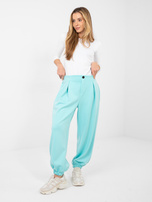 Miętowe dresowe spodnie z zakładkami