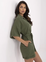 Khaki muslin jumpsuit with a tied belt.