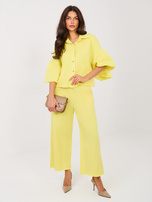 Jasnożółte damskie jeansy z ozdobnymi pomponami