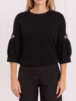 Black short sweater with rhinestones.