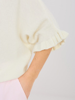 Ecru women's oversized sweater with a boat neckline.