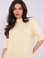 Light yellow women's short-sleeve sweater.