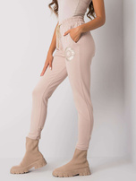 Beżowe spodnie dresowe z nadrukiem Larissa