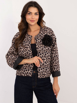 Hurtownia Beżowo-czarna kurtka przejściowa z ozdobną broszką