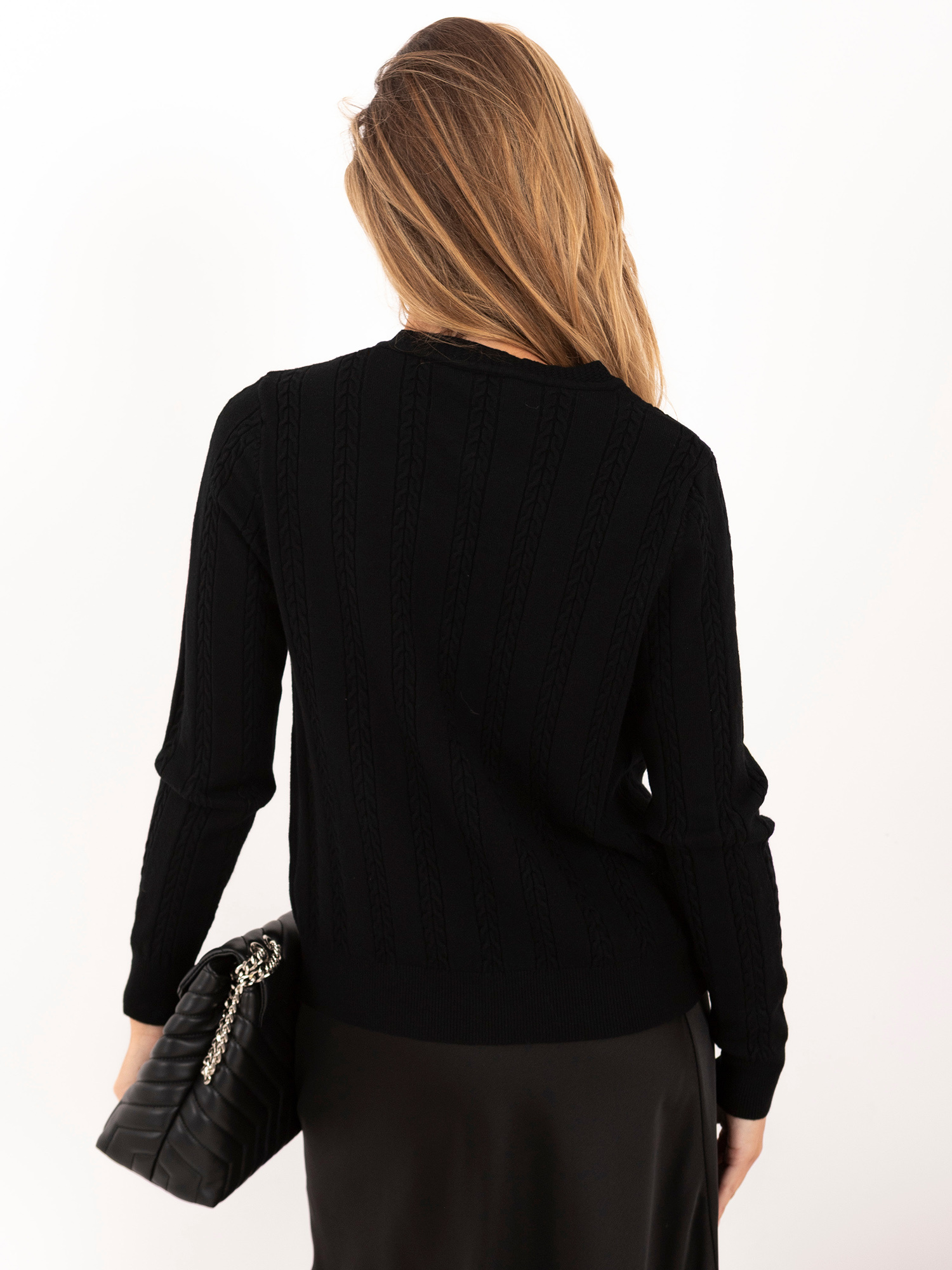 Black sweater with heart-shaped buttons.