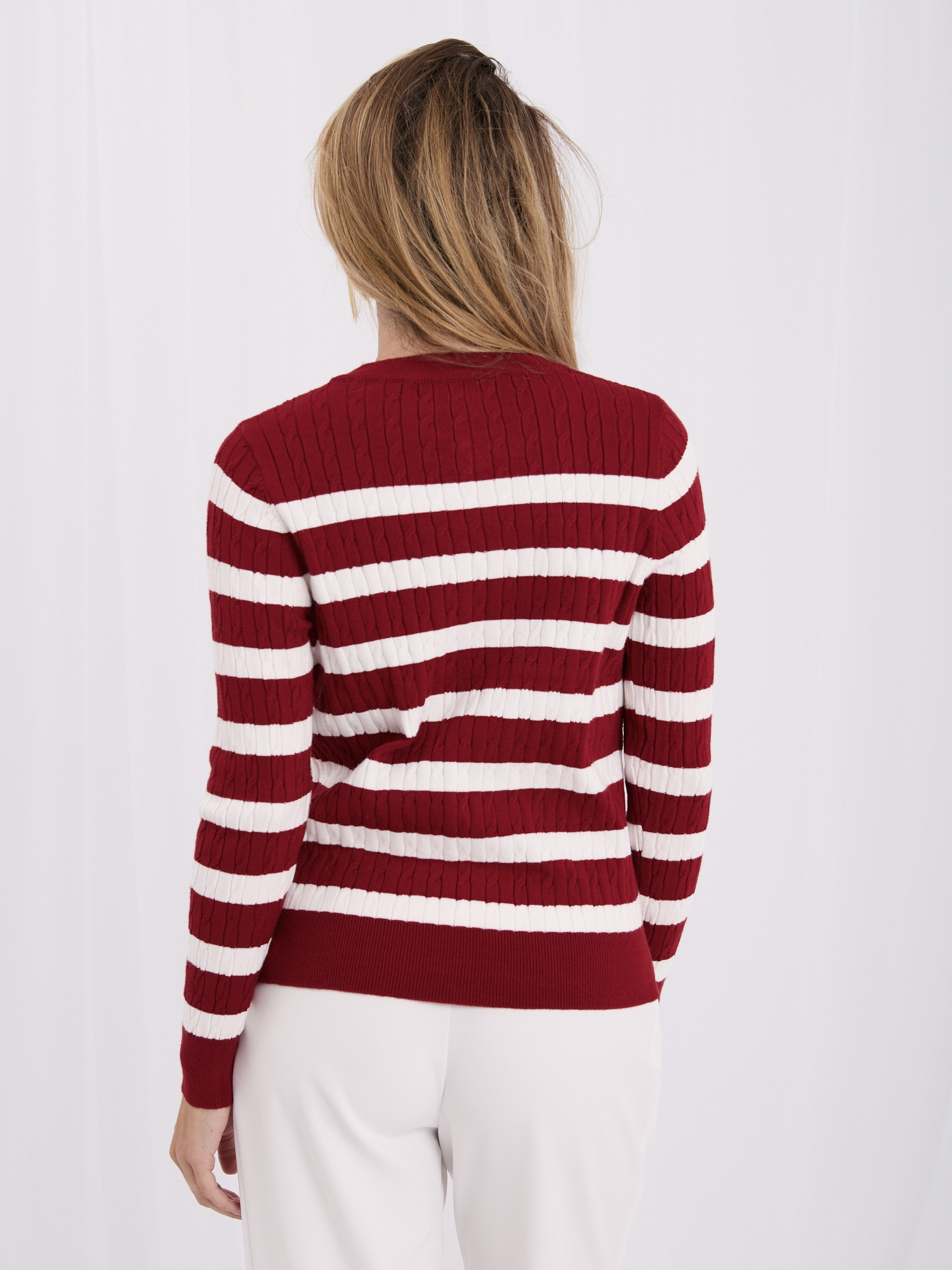 Burgundy women's cardigan with a round neckline.