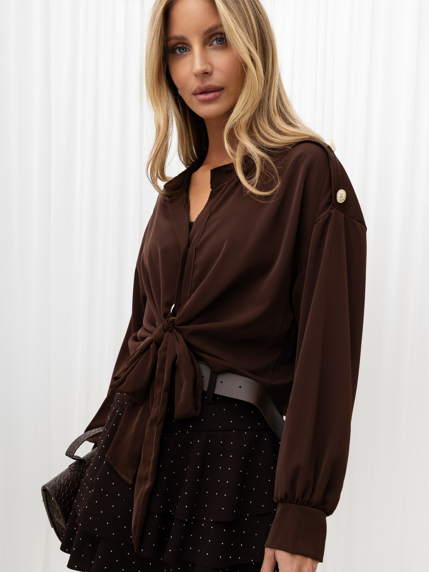 Brown short shirt with a tie.